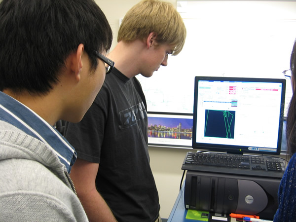 David (left) and Cody watch as the testing procedure is explained.